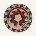Dark Waves handmade woven wicker wall basket with concentric geometric rings in beige, navy, red, and green.