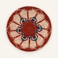 Fluorescence Subtle woven wicker wall basket with red, cream, deep blue, and teal geometric sunburst pattern