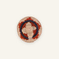 Posy mini woven wicker wall basket with concentric beige, red, and deep blue rings.