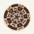 Society Distinct woven wicker wall basket with a dark brown and beige concentric geometric pattern