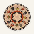 Squad woven wicker wall basket with concentric beige, black, orange, and yellow geometric patterning