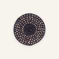 Stellar mini woven wicker wall basket with black concentric coils and beige dashed circular pattern.