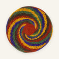Whirlpool Origin handmade woven wicker wall basket with a red center and concentric green, purple, yellow, and brown rings